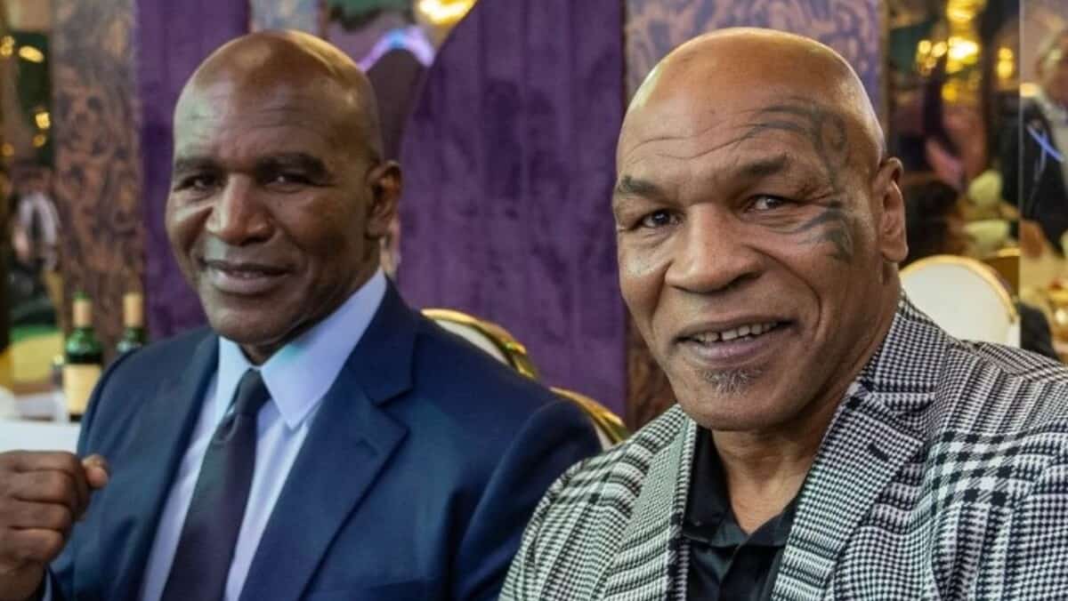 Mike Tyson and Evander Holyfield smiling